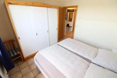 Ein Bett oder Betten in einem Zimmer der Unterkunft Horizont Wohnung 3
