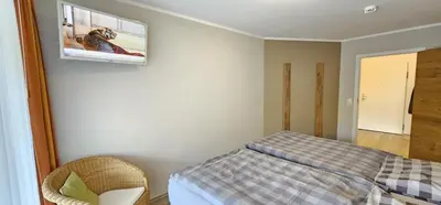 Ein Bett oder Betten in einem Zimmer der Unterkunft Nordseebrandung A1.3