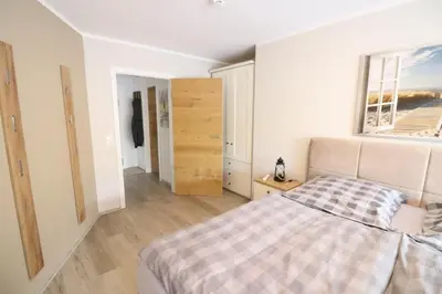 Ein Bett oder Betten in einem Zimmer der Unterkunft Nordseebrandung A1.3