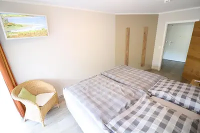 Ein Bett oder Betten in einem Zimmer der Unterkunft Nordseebrandung A1.3