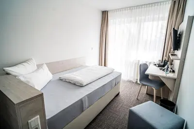 Ein Bett oder Betten in einem Zimmer der Unterkunft Hotel Seeschwalbe