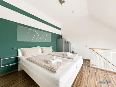 Ein Bett oder Betten in einem Zimmer der Unterkunft Residenz Hohe Lith Wohnung 34 Haus 3