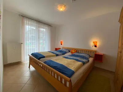 Ein Bett oder Betten in einem Zimmer der Unterkunft Duhner Brise, Ferienwohnung 2