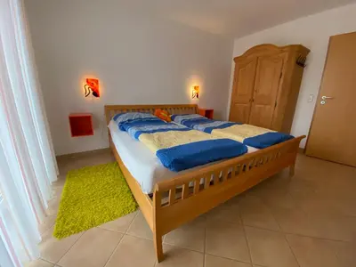 Ein Bett oder Betten in einem Zimmer der Unterkunft Duhner Brise, Ferienwohnung 2
