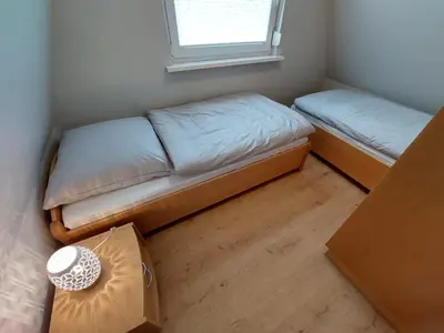 Ein Bett oder Betten in einem Zimmer der Unterkunft Am Ringwall 15