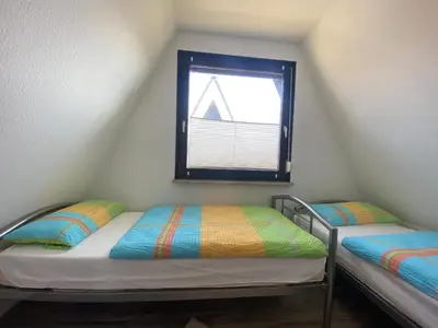 Ein Bett oder Betten in einem Zimmer der Unterkunft Am Ringwall 10