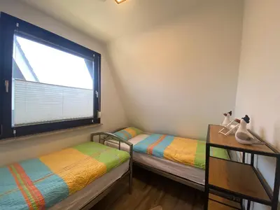 Ein Bett oder Betten in einem Zimmer der Unterkunft Am Ringwall 10
