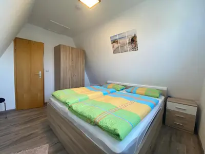 Ein Bett oder Betten in einem Zimmer der Unterkunft Am Ringwall 10