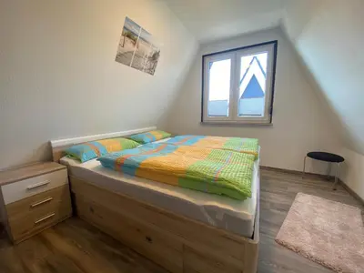 Ein Bett oder Betten in einem Zimmer der Unterkunft Am Ringwall 10