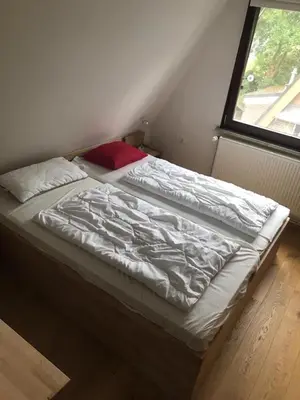 Ein Bett oder Betten in einem Zimmer der Unterkunft Am Ringwall 31