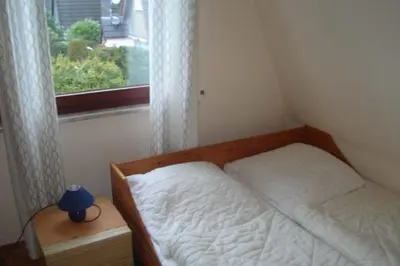 Ein Bett oder Betten in einem Zimmer der Unterkunft Kampweg 18