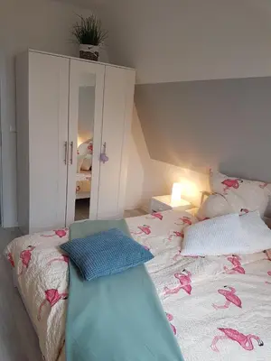 Ein Bett oder Betten in einem Zimmer der Unterkunft Kampweg 4