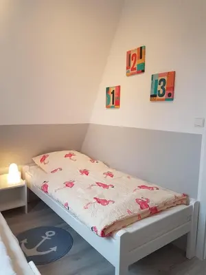 Ein Bett oder Betten in einem Zimmer der Unterkunft Kampweg 4