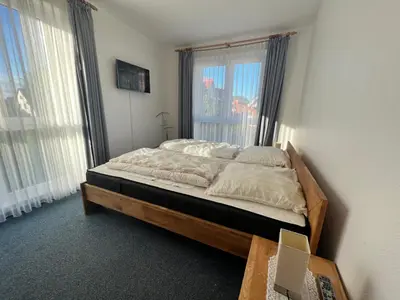 Ein Bett oder Betten in einem Zimmer der Unterkunft Voßhörn 19