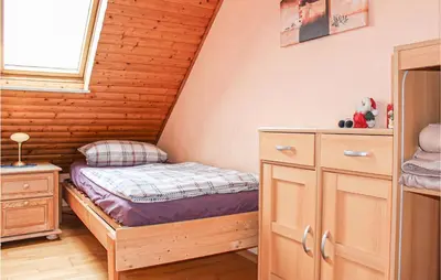 Ein Bett oder Betten in einem Zimmer der Unterkunft Nice Apartment In Wurster Nordseeküste
