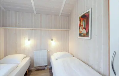 Ein Bett oder Betten in einem Zimmer der Unterkunft Friedrichskoog-Strandpark 15