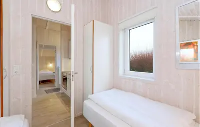 Ein Bett oder Betten in einem Zimmer der Unterkunft Friedrichskoog-Strandpark 15