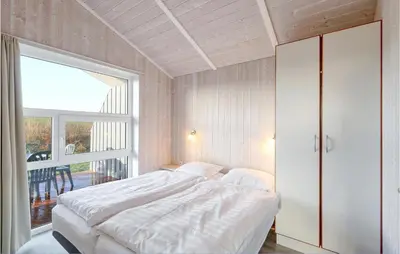 Ein Bett oder Betten in einem Zimmer der Unterkunft Friedrichskoog-Strandpark 15