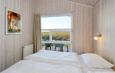 Ein Bett oder Betten in einem Zimmer der Unterkunft Friedrichskoog-Strandpark 16