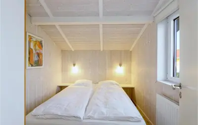 Ein Bett oder Betten in einem Zimmer der Unterkunft Friedrichskoog-Strandpark 16