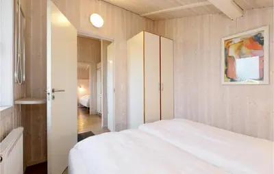 Ein Bett oder Betten in einem Zimmer der Unterkunft Friedrichskoog-Strandpark 16