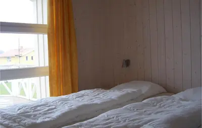 Ein Bett oder Betten in einem Zimmer der Unterkunft Friedrichskoog-Strandpark 20