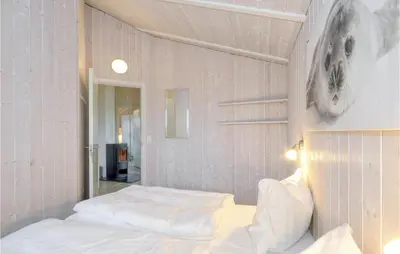 Ein Bett oder Betten in einem Zimmer der Unterkunft Friedrichskoog-Strandpark 17