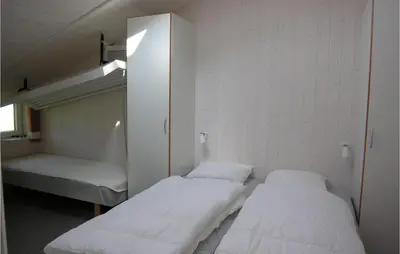Ein Bett oder Betten in einem Zimmer der Unterkunft Friedrichskoog-Strandpark 3