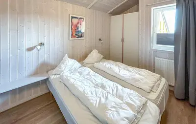 Ein Bett oder Betten in einem Zimmer der Unterkunft Friedrichskoog-Strandpark 3