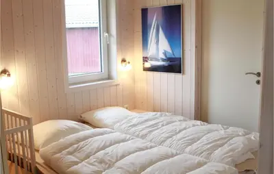 Ein Bett oder Betten in einem Zimmer der Unterkunft Friedrichskoog-Deichblick 22