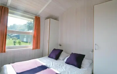 Ein Bett oder Betten in einem Zimmer der Unterkunft Friedrichskoog-Strandpark 5