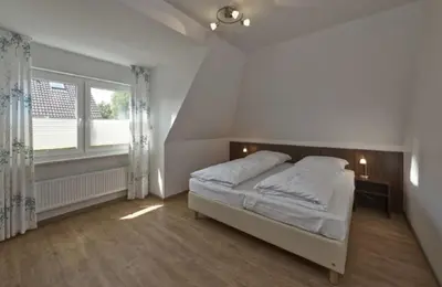 Ein Bett oder Betten in einem Zimmer der Unterkunft Op de Geest 14