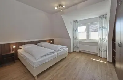 Ein Bett oder Betten in einem Zimmer der Unterkunft Op de Geest 14