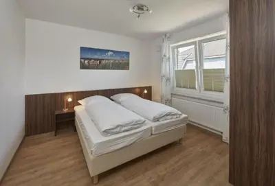 Ein Bett oder Betten in einem Zimmer der Unterkunft Op de Geest 10