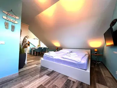 Ein Bett oder Betten in einem Zimmer der Unterkunft Sanibel Island -by Mila FerienARPartments- Büsum Zentrum eigener Parkplatz