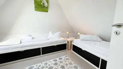 Ein Bett oder Betten in einem Zimmer der Unterkunft strandnahe Ferienwohnung mit zwei sep. Schlafzimmern