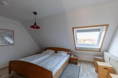 Ein Bett oder Betten in einem Zimmer der Unterkunft Haus Stranddüne, Whg 6