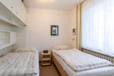 Ein Bett oder Betten in einem Zimmer der Unterkunft Haus Essen, Whg 5