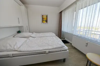 Ein Bett oder Betten in einem Zimmer der Unterkunft Haus 