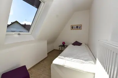 Ein Bett oder Betten in einem Zimmer der Unterkunft Kapitäns-Hus KH01