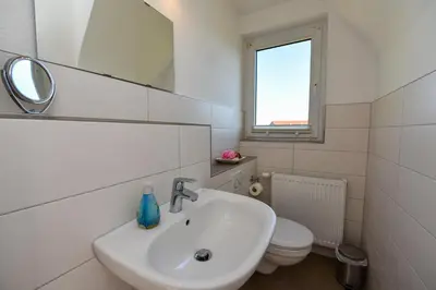 Ein Badezimmer in der Unterkunft Kapitäns-Hus KH01