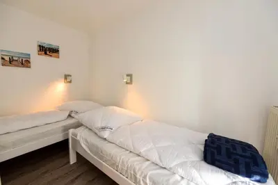 Ein Bett oder Betten in einem Zimmer der Unterkunft Appartementhaus 