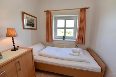 Ein Bett oder Betten in einem Zimmer der Unterkunft 