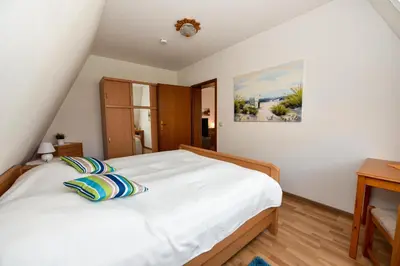 Ein Bett oder Betten in einem Zimmer der Unterkunft Haus 