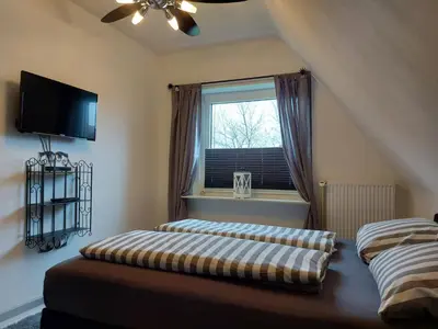 Ein Bett oder Betten in einem Zimmer der Unterkunft Ferienwohnung Strandnah