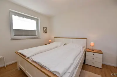 Ein Bett oder Betten in einem Zimmer der Unterkunft Haus 