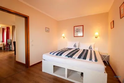 Ein Bett oder Betten in einem Zimmer der Unterkunft Haus Elbe Döse Wohnung 17