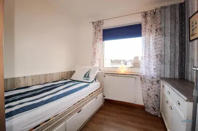 Ein Bett oder Betten in einem Zimmer der Unterkunft Haus Elbe Döse Wohnung 17