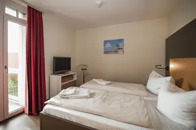 Ein Bett oder Betten in einem Zimmer der Unterkunft Resort Deichgraf Resort Deichgraf 27-07