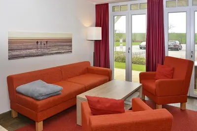Ein Sitzbereich in der Unterkunft Resort Deichgraf Resort Deichgraf 27-03